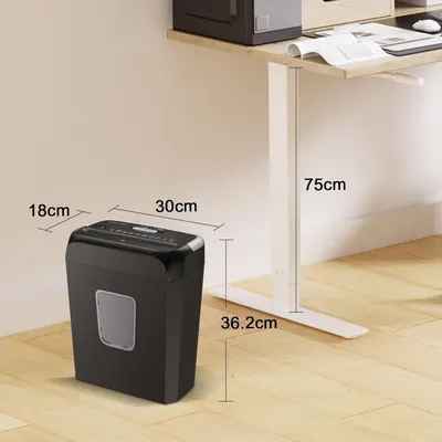 Communicates the exact physical dimensions of the paper shredder (30cm x 18cm x 36.2cm) and shows how it fits under a desk at 75cm height, helping shoppers understand the product's compact size and…