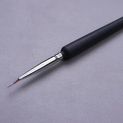 Provides a clean, catalog-style view of the product (a precision brush or applicator tool) on a neutral background to show its design and fine tip detail.