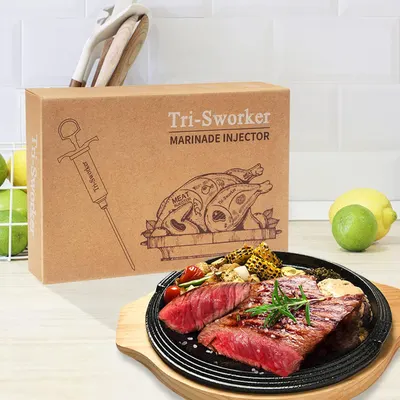 Shows the product packaging alongside the finished result (cooked steak) to demonstrate what the marinade injector can help achieve and give shoppers confidence in the product's effectiveness.