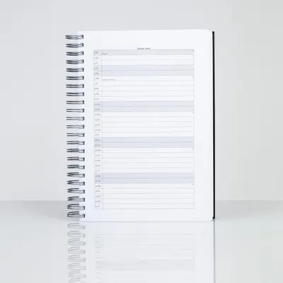 Displays the spiral-bound calendar/planner product on a clean white background to show the physical product clearly without distractions.