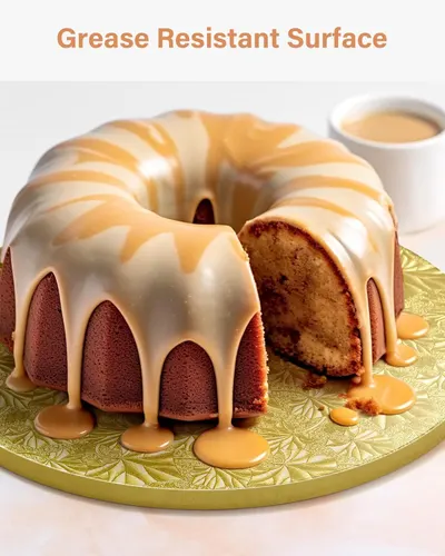 Demonstrates the grease-resistant property of the cake board by showing it in use with a glazed cake, reassuring shoppers that the surface can handle messy toppings.