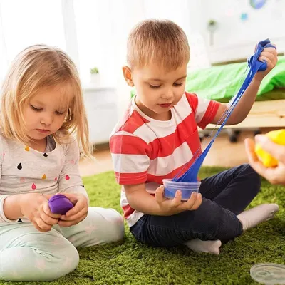 Depicts children engaged in play with the clay to show the product in a real-world context and appeal to parents.