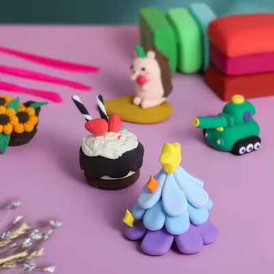 Displays finished clay creations in a real-world setting to inspire shoppers and demonstrate the creative possibilities of the product.