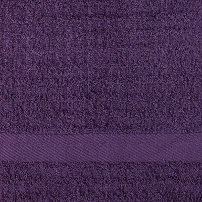 Close-up white background shot highlighting the towel's textured weave and decorative band detail.