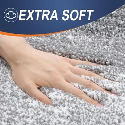 Highlights the plush, soft texture of the bath mat to communicate comfort and luxury underfoot.