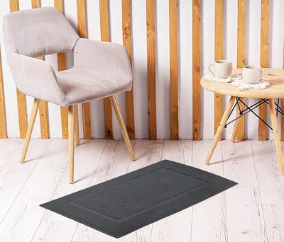 Demonstrates how the bath mat fits into a styled home environment with furniture and decor, showing its aesthetic appeal.