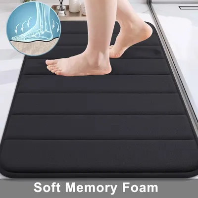 Highlights the soft memory foam material with a close-up of feet on the mat and a cross-section diagram, emphasizing comfort and cushioning for the user.