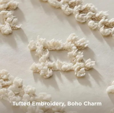 Highlights the decorative tufted embroidery detail and boho charm of the product to appeal to shoppers seeking stylish, textured bedding.