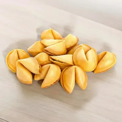 Presents the fortune cookies in a clean, simple arrangement to help shoppers see the product's appearance and quantity in a real-world context.