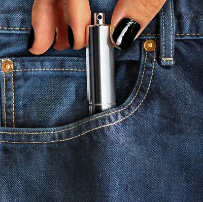 Shows the product in a real-world context fitting in a jeans pocket with no text overlay to demonstrate its compact, portable nature.