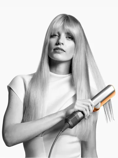 Demonstrates the product in use to show the sleek, professional hair styling results achievable with the tool.