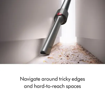 Demonstrates the vacuum's ability to navigate around tricky edges and reach difficult spaces like corners and baseboards.