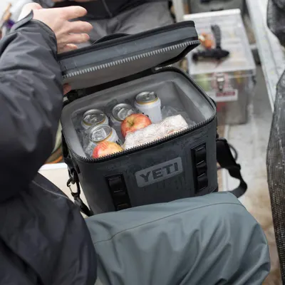 Demonstrates the cooler being used in a real-world setting with beverages and food inside, helping shoppers visualize the product in everyday use without any…