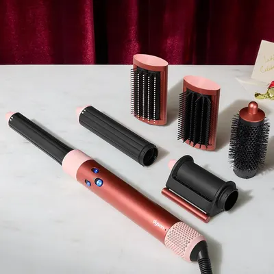 Shows all the styling attachments and accessories included with the product to communicate the complete value and versatility of the purchase. Positions the product as a premium gift option with…