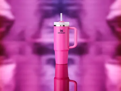 Showcases the product in an artistic, visually appealing setting with a reflective surface and blurred pink background to create an aspirational lifestyle…