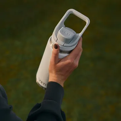 Shows the product being held in a real-world outdoor setting to help shoppers visualize portability and everyday use.