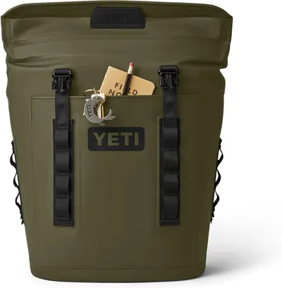 Highlights the front pocket's accessibility and storage capability by showing items stored in the pocket for quick access.