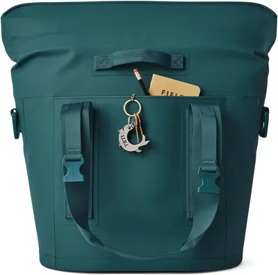 Highlights the convenient external kangaroo pocket feature for quick access to small items like keys and field notes.