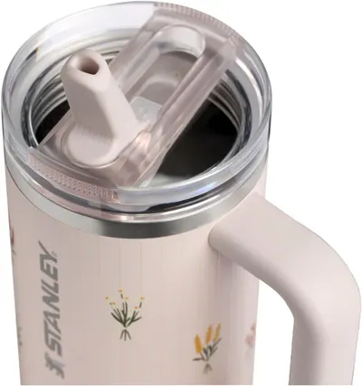 Shows the product in a real-world context with a close-up view of the flip straw lid mechanism, allowing shoppers to visualize the product design and…