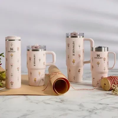 Displays multiple Stanley Quencher products from the same decorative collection in various sizes and styles, helping shoppers understand the available options within the product family.