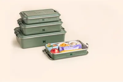 Showcases the brand's product lineup with multiple size options and demonstrates versatility with one container showing food storage use.