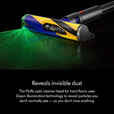 Highlights the Fluffy Optic cleaner head's illumination technology that reveals hidden dust particles on hard floors, reassuring shoppers they won't miss any dirt.