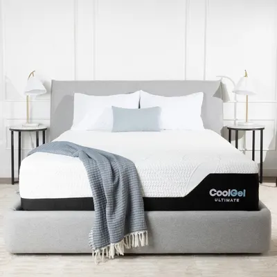 Shows the mattress fully styled in an elegant bedroom setting to help shoppers envision how the product will look in their home.