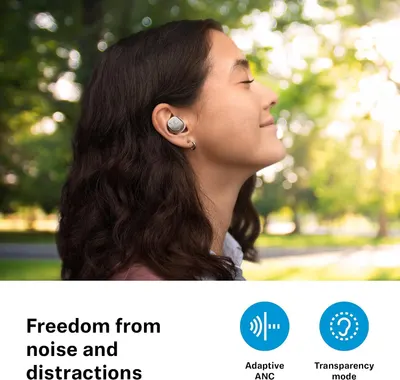 Shows a calm lifestyle scene with the headline Freedom from noise and distractions to reassure shoppers the earbuds block noise and let them stay aware.