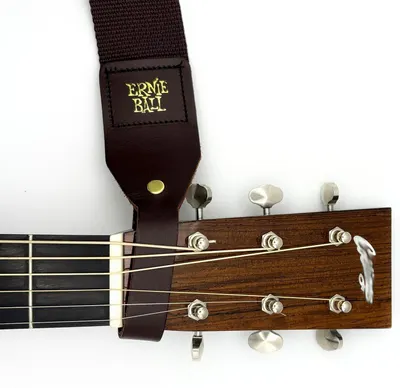 Shows the brown strap alone on white so shoppers see its full length and leather end tab.