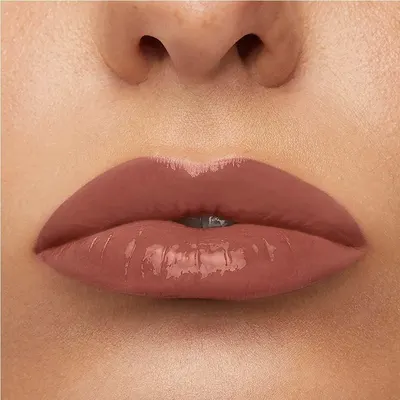 Shows the finished glossy lip look in close-up so shoppers can judge shade and shine.