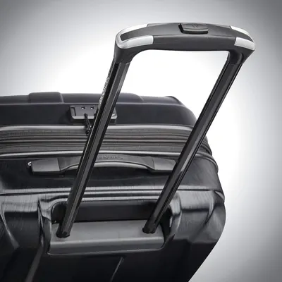 Close-up of the extended trolley handle shows a solid, easy-to-pull handle for comfortable transport.