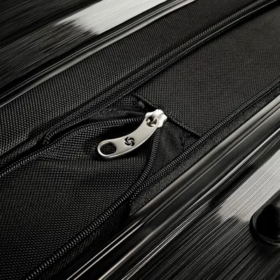 Close-up of the zipper pull and fabric trim signals a finished, well-made closure.