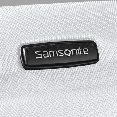 Close-up of the textured shell and Samsonite badge signals a durable, premium exterior finish.