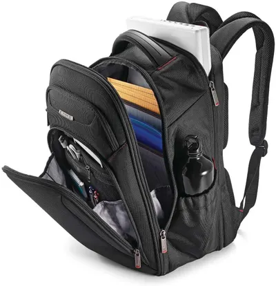 Open bag with laptop, folders and bottle shows the roomy, organized interior in everyday use.