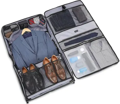 Shows a suit, shoes and toiletries packed inside the case so shoppers picture a real business trip.