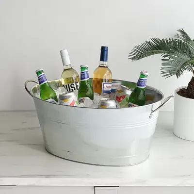 Shows the bucket in a real home setting filled with drinks to inspire entertaining.