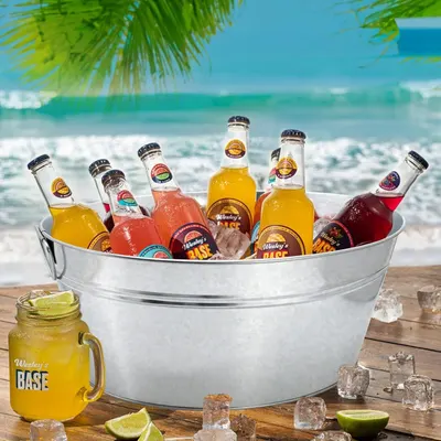 Shows the tub holding many bottles on a beach scene to convey its generous size for summer drinks.