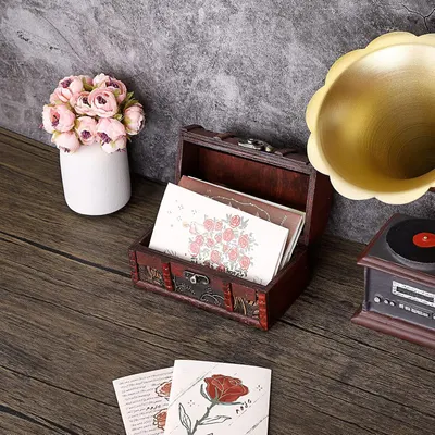 Shows the box holding greeting cards to communicate its use as a keepsake organizer.