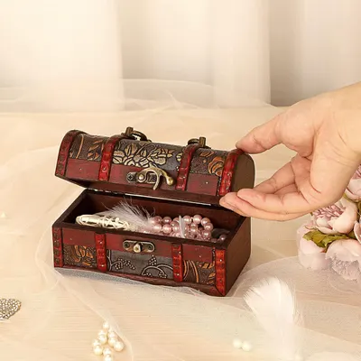 Shows the box holding jewelry and being opened easily to show practical everyday storage.