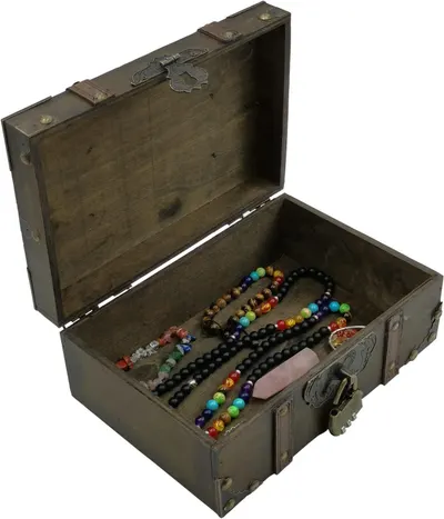 Shows the open trunk filled with jewelry from an angled view to suggest real-world use for storing accessories.