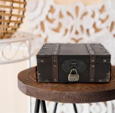 Shows the box styled on a wooden stool in a home setting to suggest decorative use.