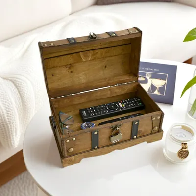 Shows the chest used to store everyday items like remotes and glasses in a living space. Reassures shoppers that stored items stay private with the combination lock.
