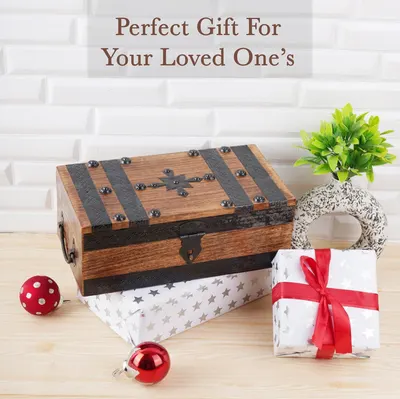 Positions the wooden treasure chest as a gift for a loved one, reinforced by wrapped gift boxes, red ribbon, and holiday ornaments. Uses one lifestyle scene and one headline to communicate that this…