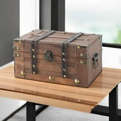 Highlights the classic vintage look and solid construction of the trunk in a single styled scene.