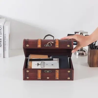 Shows the chest in a real desk setting holding notebooks and pens to suggest everyday practical use.