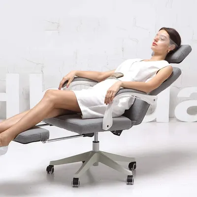 Shows the chair reclined with footrest extended to convey relaxed, full-body comfort.
