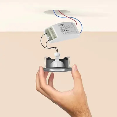 Illustrates how the driver and fitting connect for simple installation in existing recessed ceiling setups.