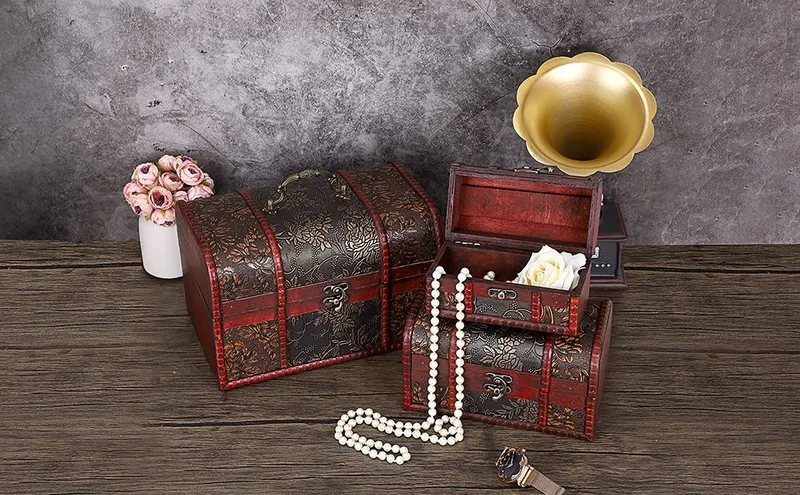Shows the brand's set of vintage-style treasure chest keepsake boxes in multiple sizes so shoppers see the full collection and feel the timeless decorative…