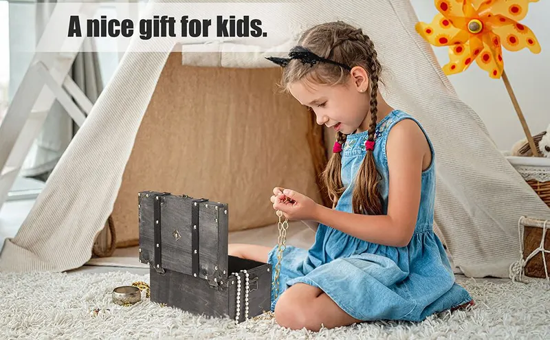 Shows a child playing with the treasure chest in a cozy home setting to help shoppers picture it as a gift for kids. Frames the product as a gift for children…
